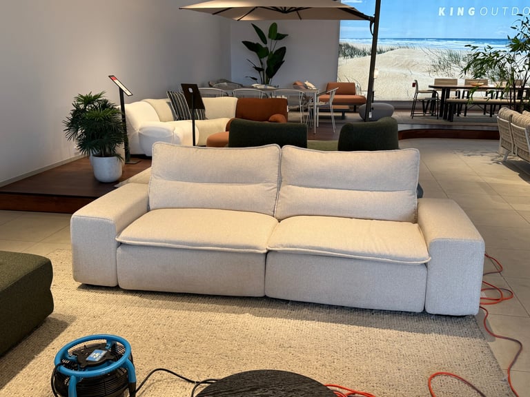 Cream-colored modern sofa after professional cleaning