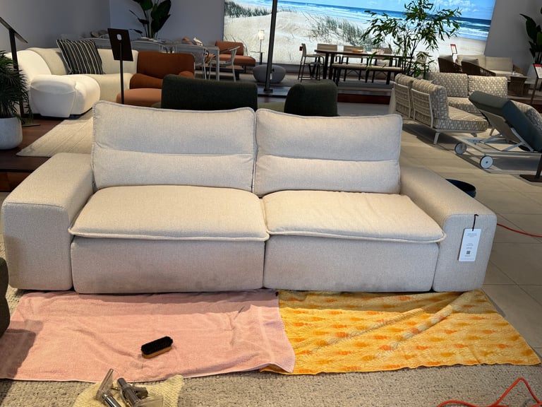 Beige two-seat sofa before cleaning