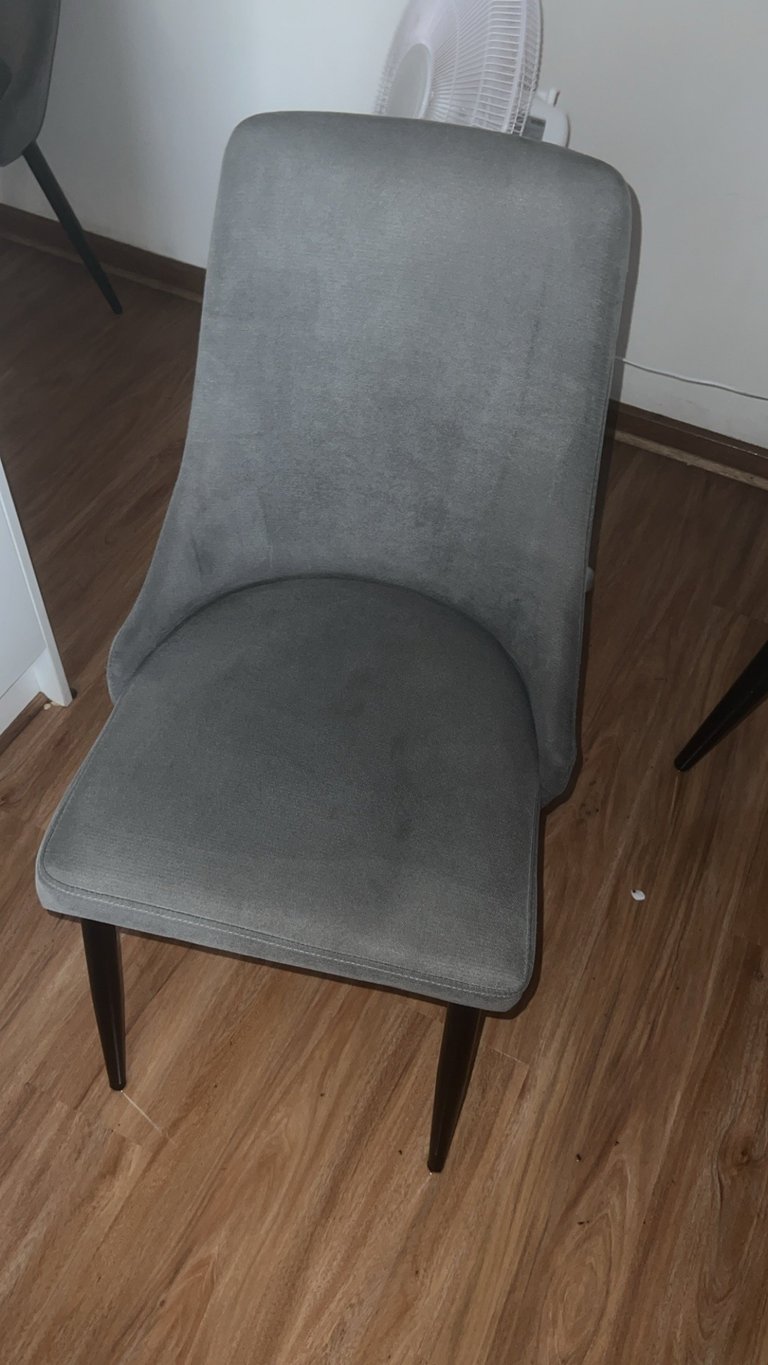 Gray upholstered dining chair after professional cleaning